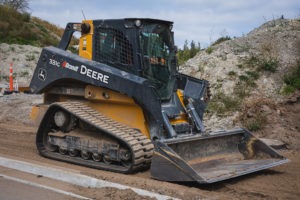 John Deere CTL clearing a path